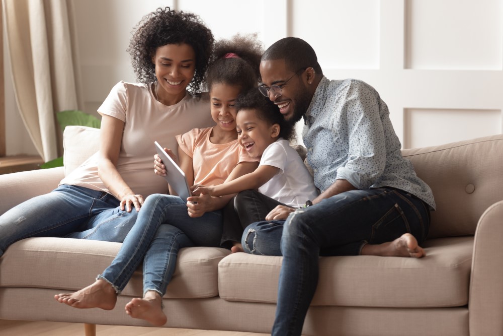 family sitting on couch