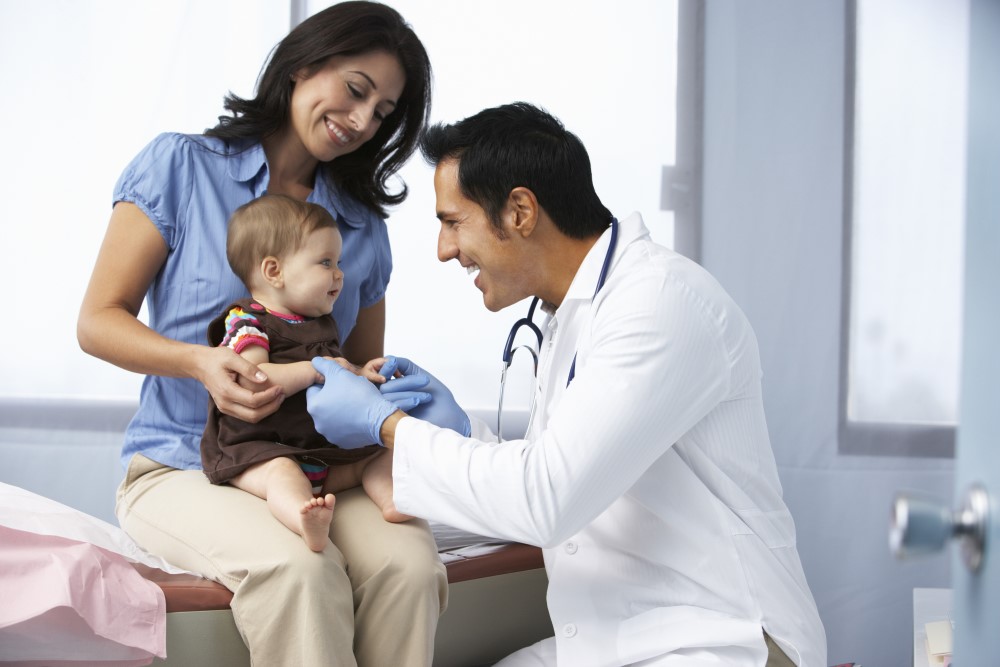 doctor with mother and child